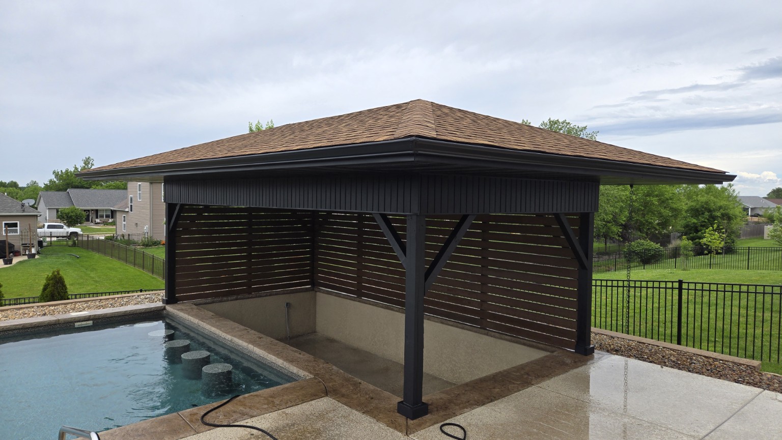 Full angled view of the completed poolside pavilion